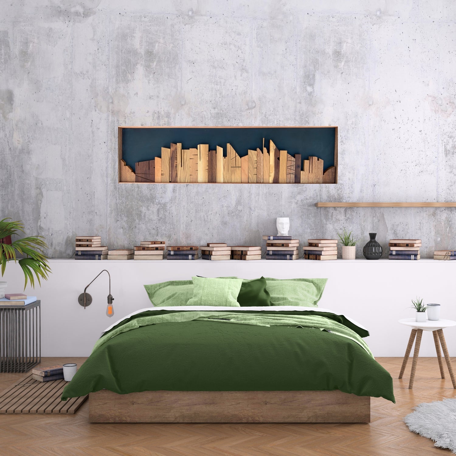 Handmade wooden cityscape wall art featuring a carved skyline silhouette in mixed hardwoods, set against a deep blue painted backdrop and displayed above a green-accented bed in a modern bedroom with a concrete feature wall and stacked books decor.