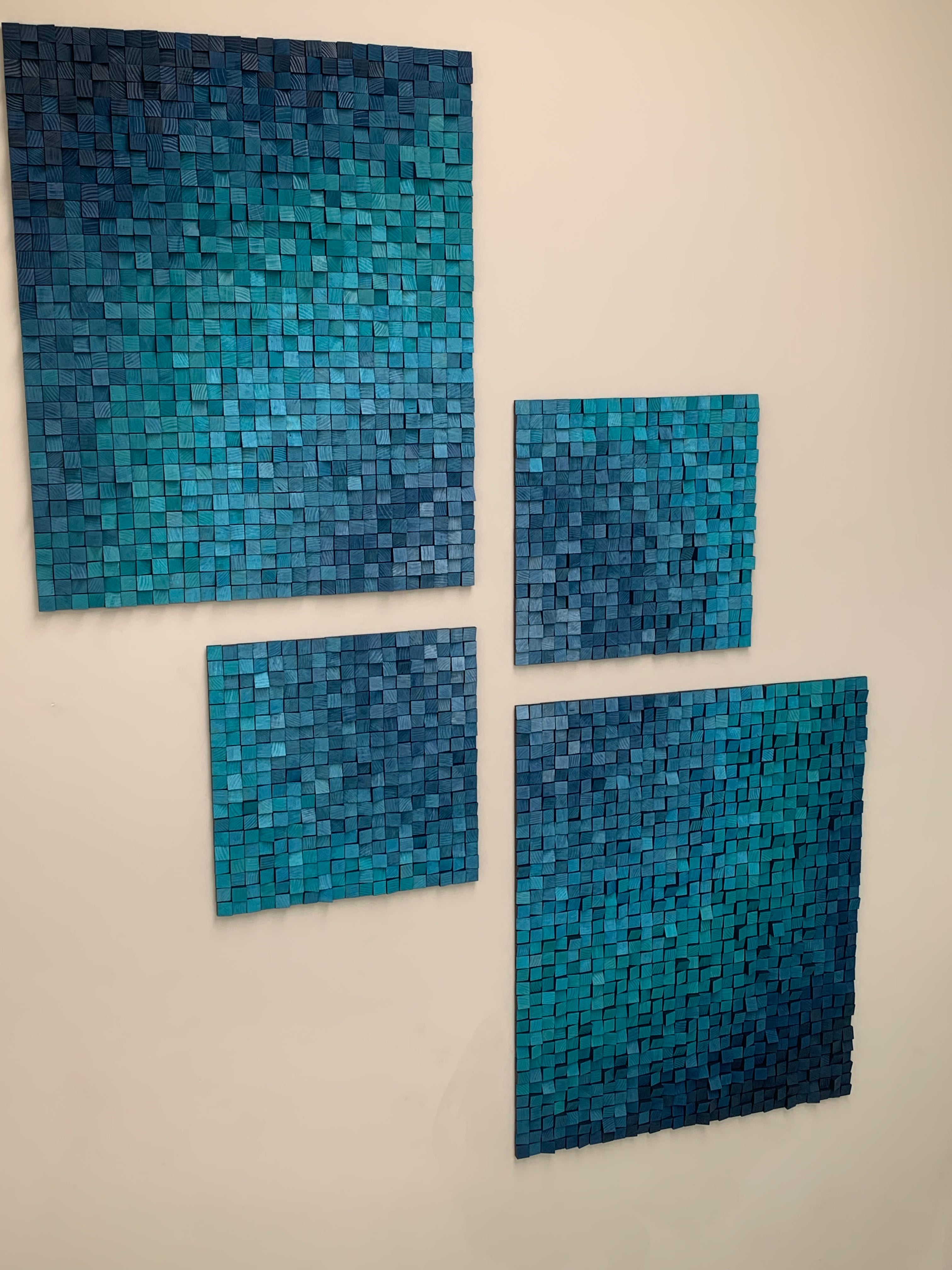 Detailed view of four-piece liquid metal blue and turquise acoustic wall artwork – geometric composition handcrafted for House Platten”