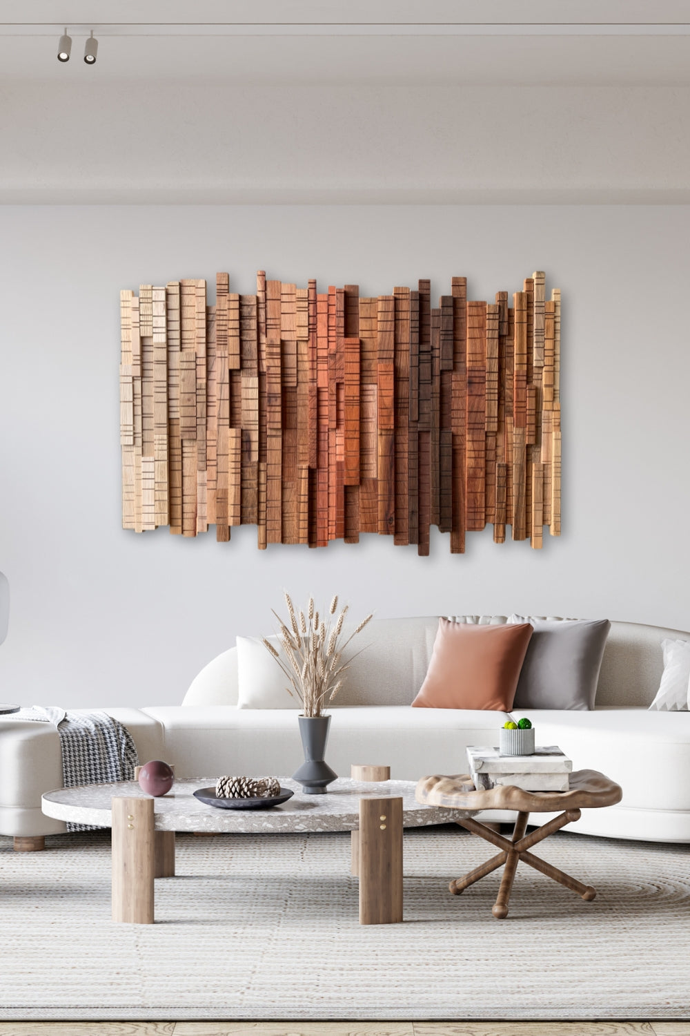 A Walk Through the Forest wooden wall art displayed above a white sofa in a light neutral living room.