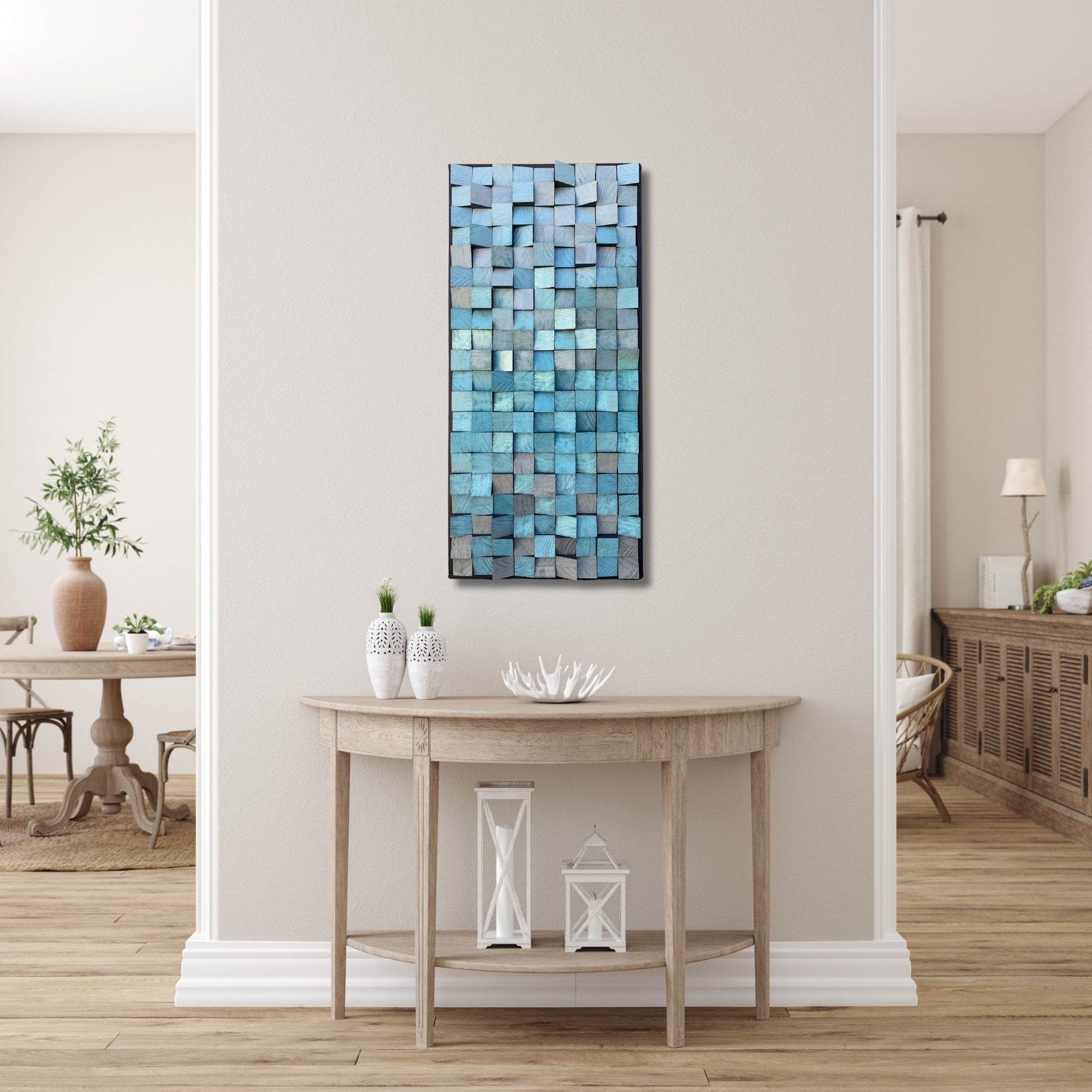 Handmade wooden wall art featuring sculpted blocks in a blue and grey colour palette. Painted with liquid metal finishes for subtle shimmer and dimension. Vertical mosaic-style panel with a flowing, textured surface.