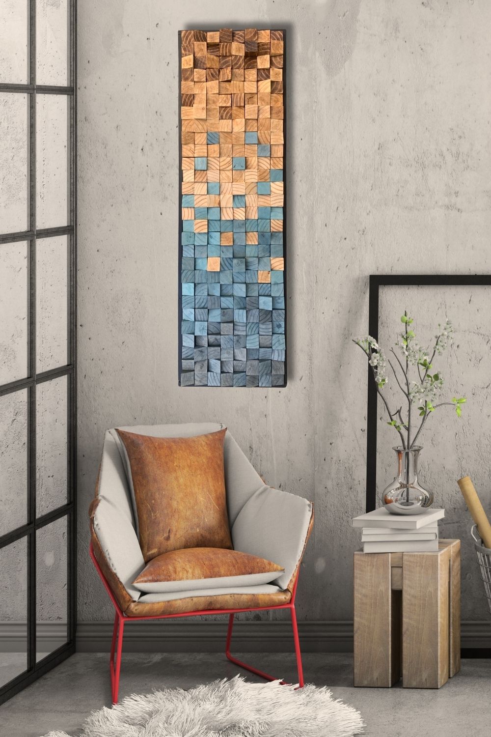 Blue and natural gradient wooden wall art displayed in an industrial-style interior with a chair, side table, and textured wall.