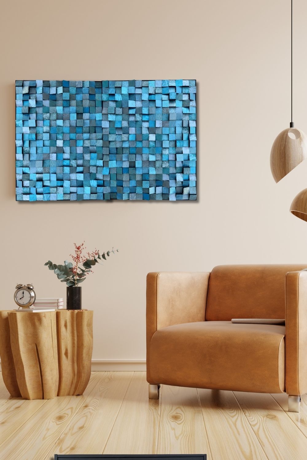 Blue liquid metal wood mosaic wall art displayed in a warm modern interior with a tan leather chair and natural wood accents.