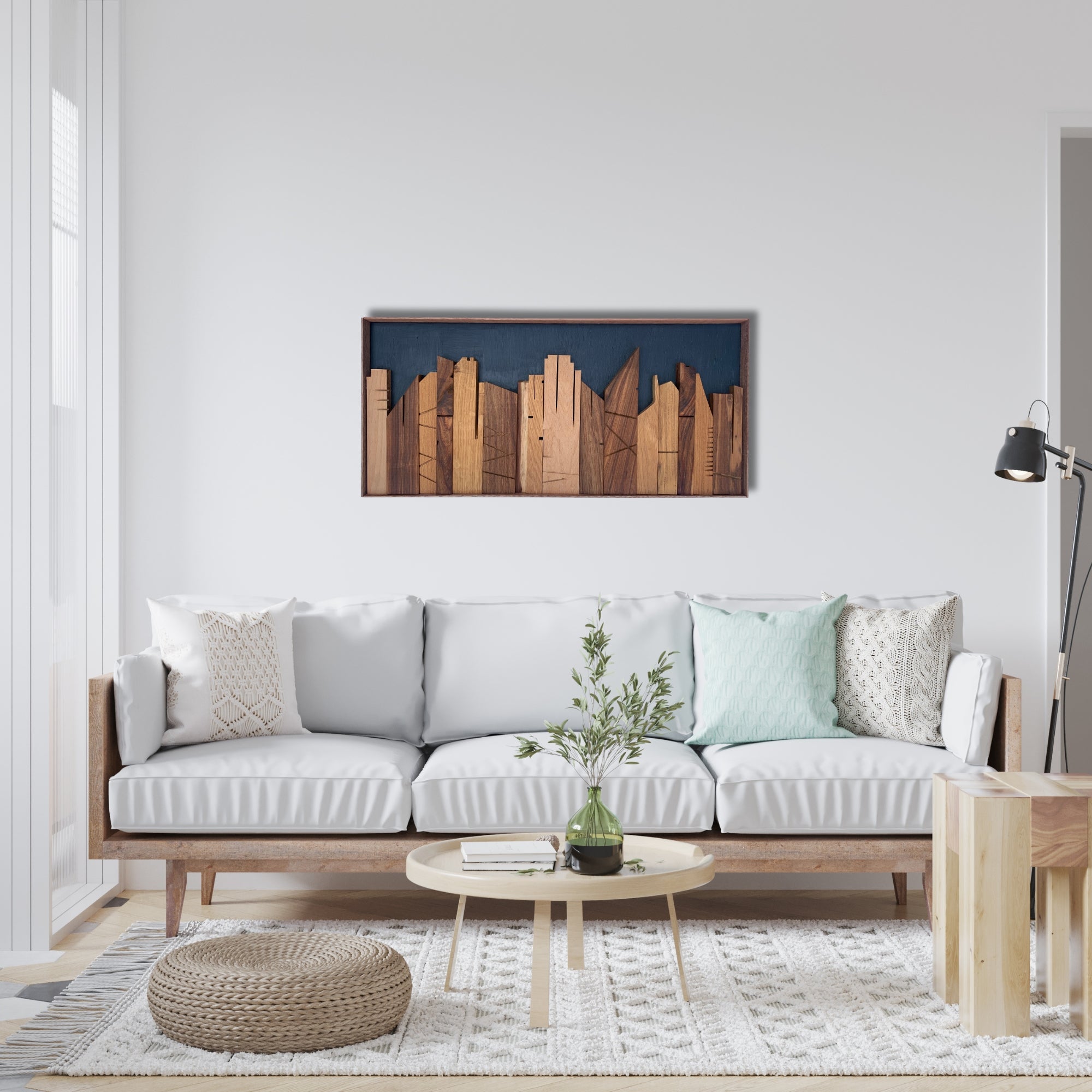 Handcrafted wooden wall art from the Cityscape Collection, featuring a stylised skyline cut from exotic hardwoods. Set against a deep blue painted background with fine engraved architectural lines. Horizontal framed silhouette for modern interiors.
