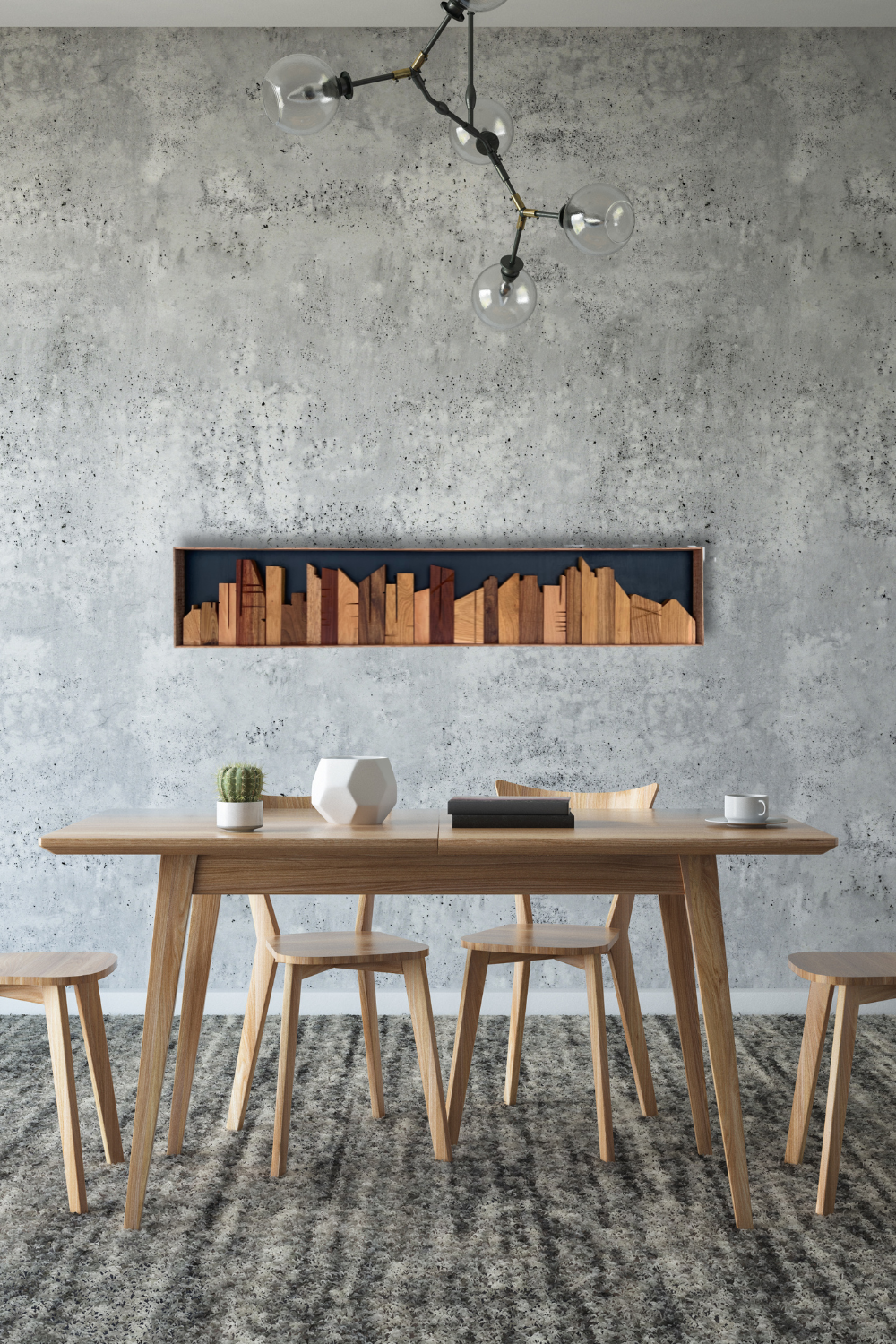 Cityscape wooden wall art displayed above a dining table on a textured wall in a modern interior.