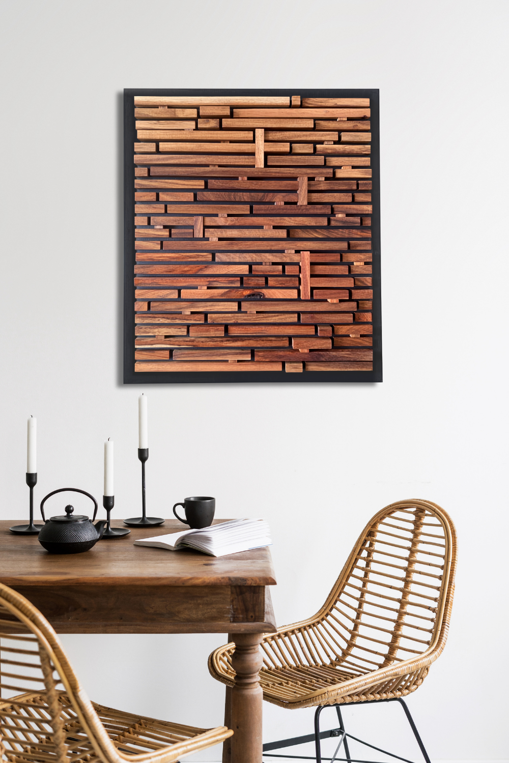 Finding the Way sculptural Kiaat wood wall art displayed above a dining table in a contemporary interior.