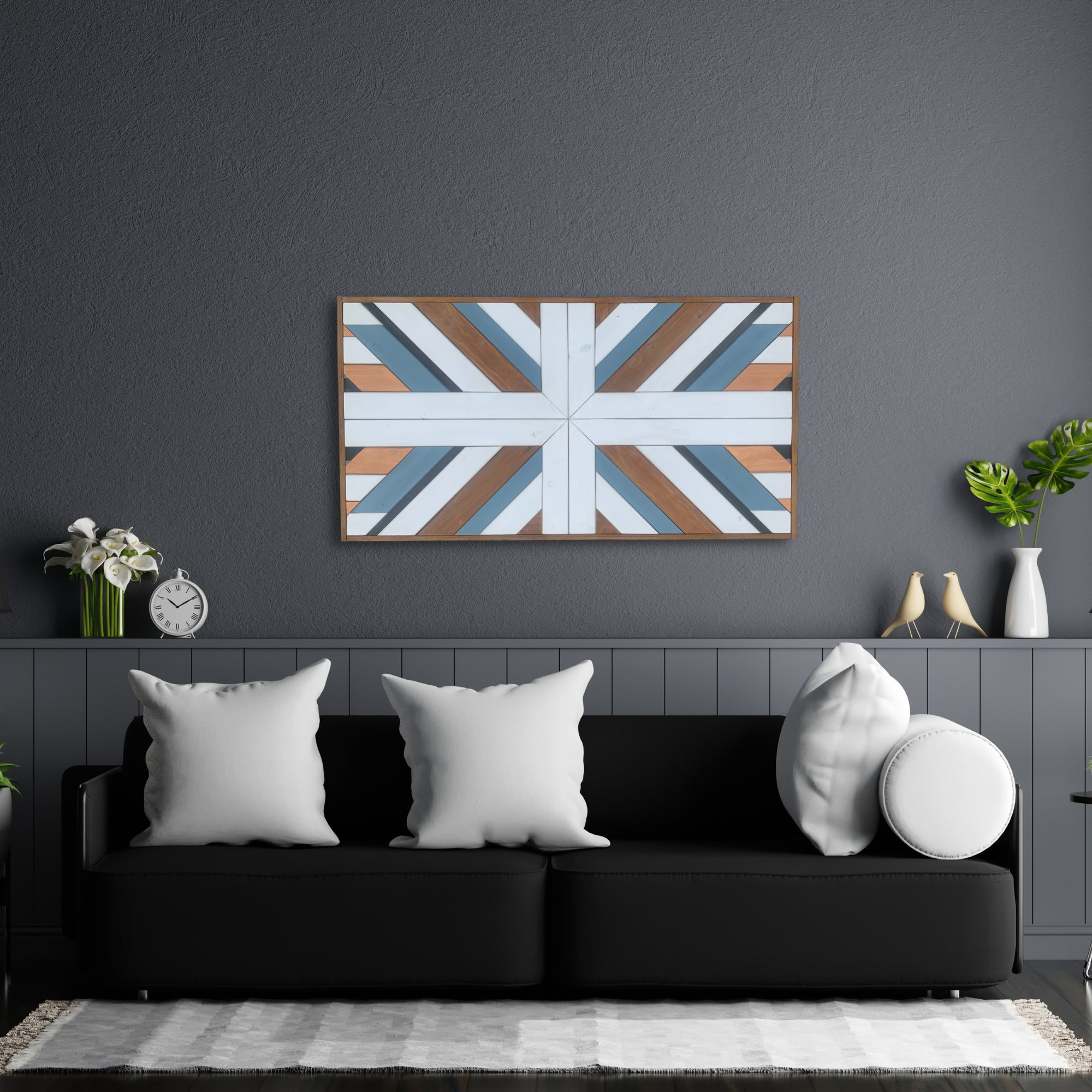 Blue and white geometric wooden wall art displayed above a sofa in a dark modern interior.