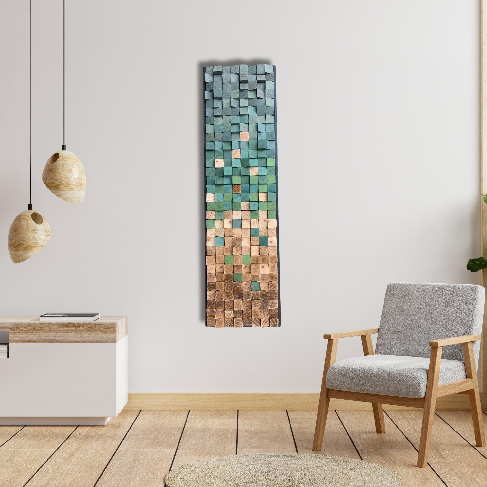 Vertical wooden wall art made from painted pine blocks in green and teal tones, blending into natural wood blocks finished with light and dark wax. Sculptural gradient effect with a mosaic texture, inspired by nature and movement.