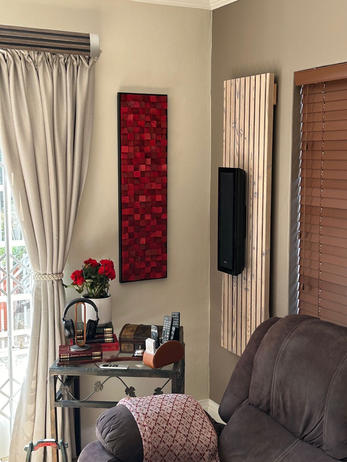 Red acoustic wood wall panel made from painted pine blocks, custom-built for a residential living room space