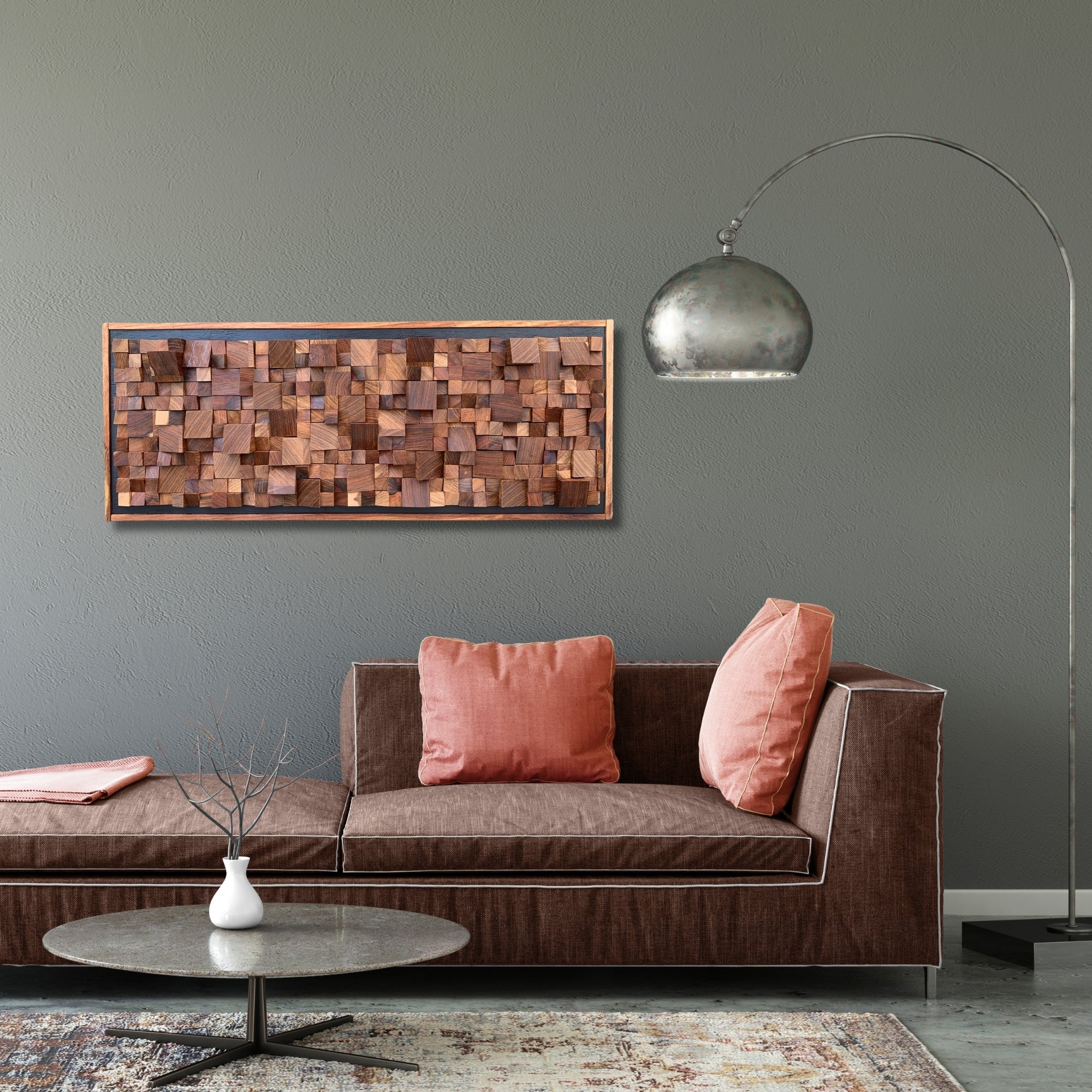 Handmade wooden wall art crafted from Kiaat wood, featuring a mix of large and small blocks arranged in a textured, sculptural composition. Framed in a horizontal layout with rich natural tones and geometric depth.