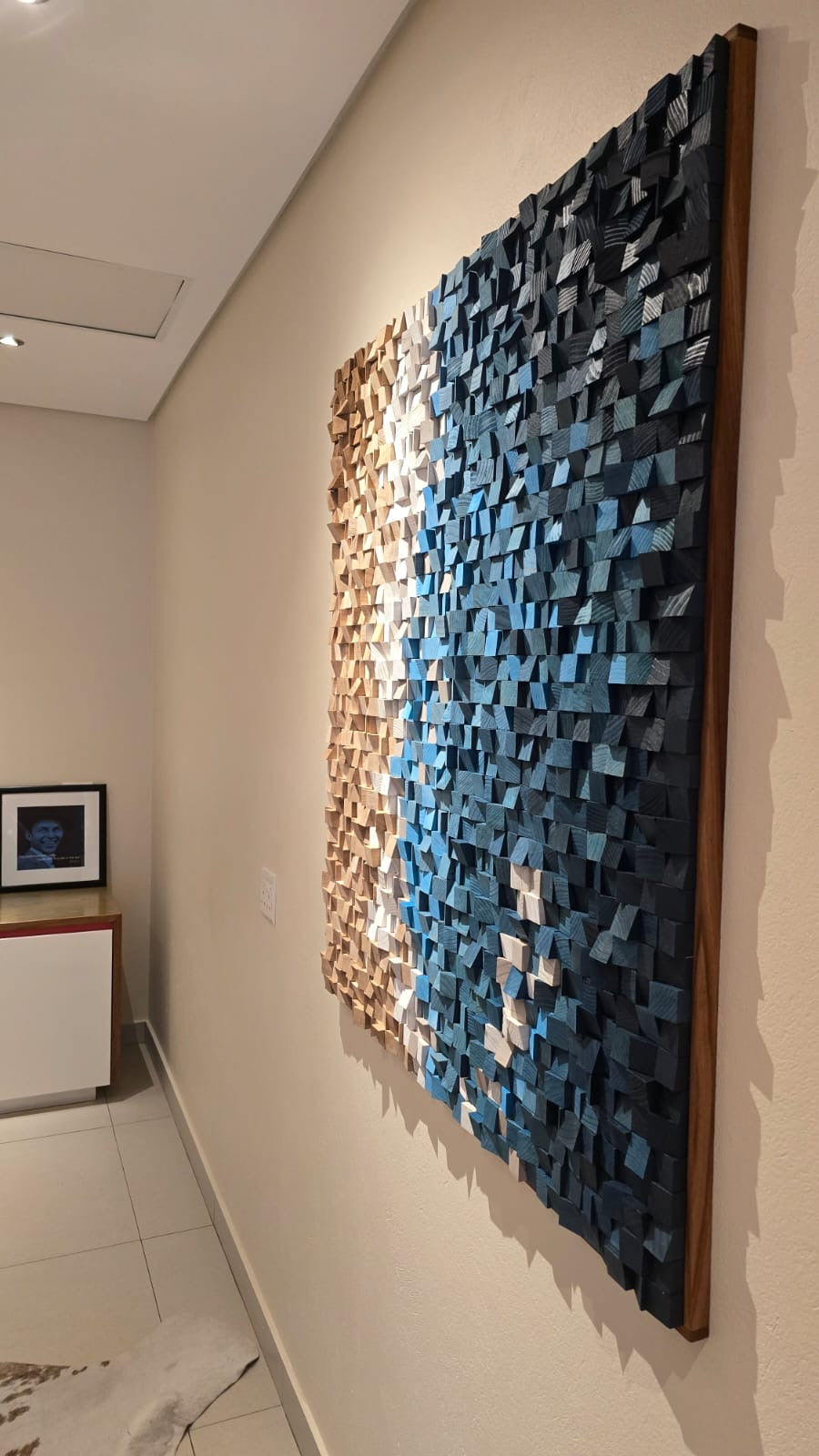 Close-up of liquid metal painted pine blocks representing ocean waves in commissioned beach scene wood artwork for House Keller