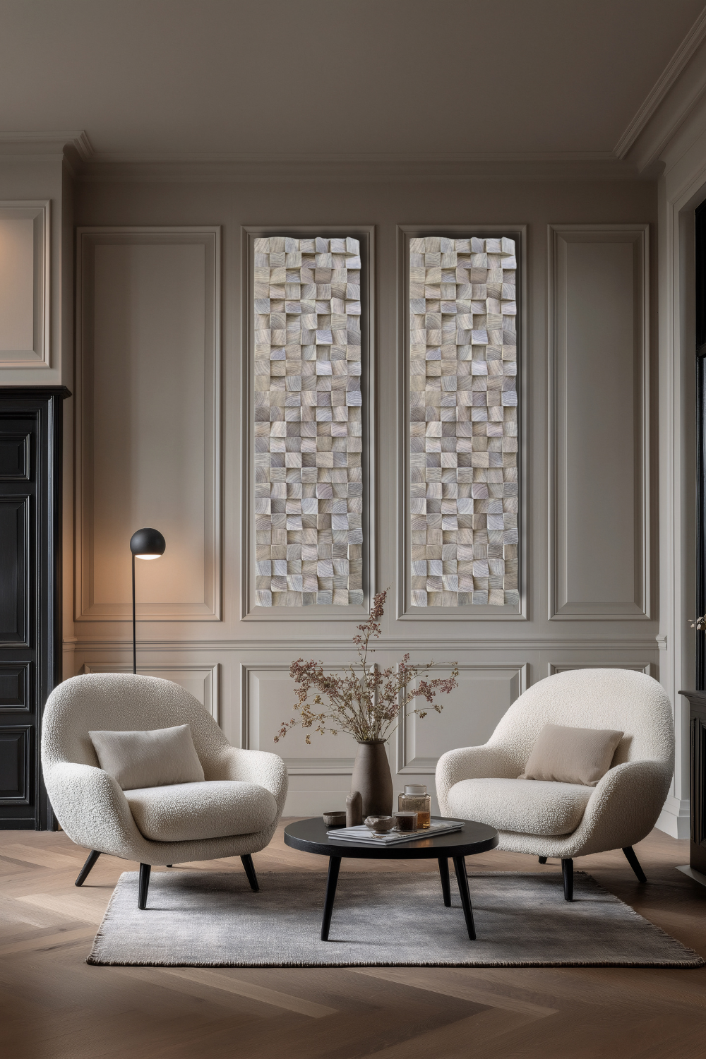Pair of oak block wall art panels displayed in a refined neutral living room with wall panelling and soft armchairs.